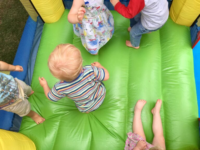 Overhead view of kids jumping in bounce house